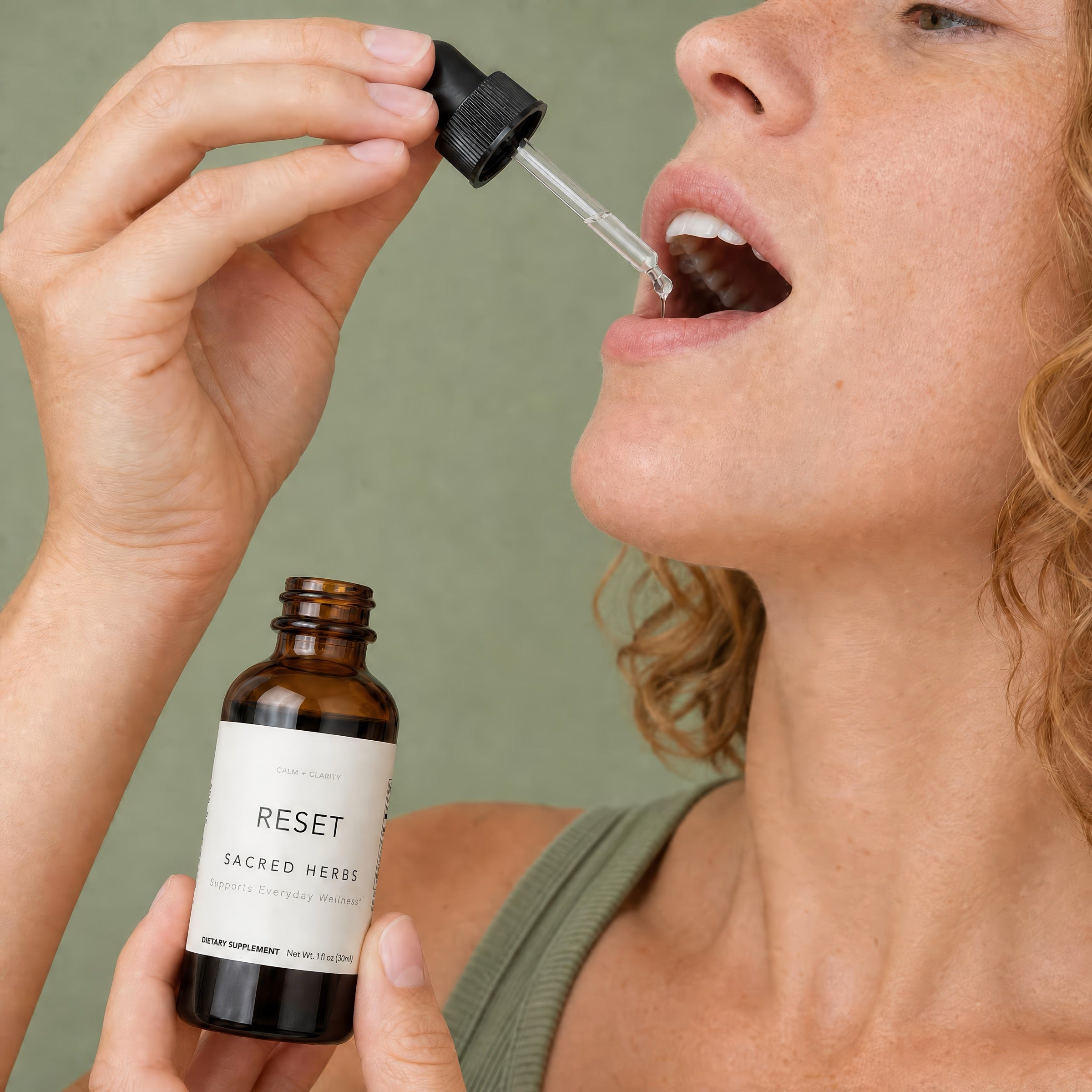 A person taking RESET drops