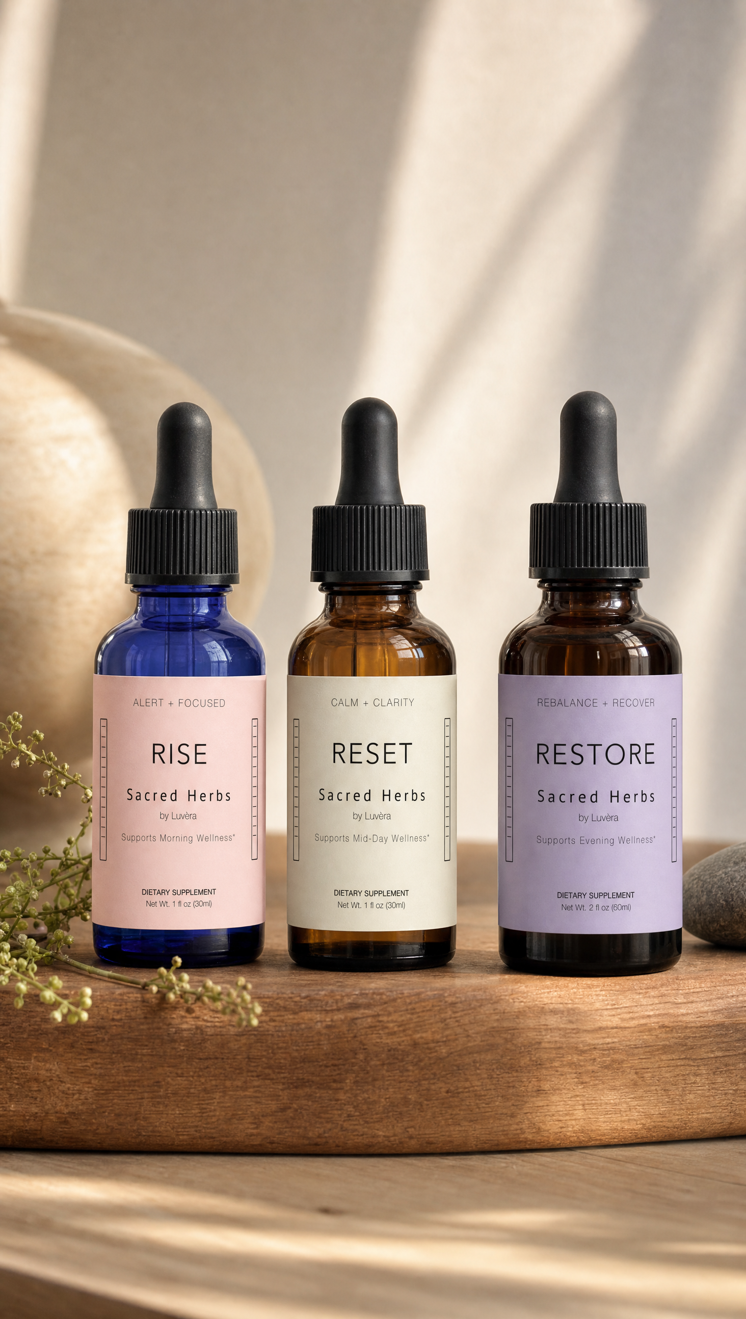 RISE, RESET, and RESTORE bottles together in warm light